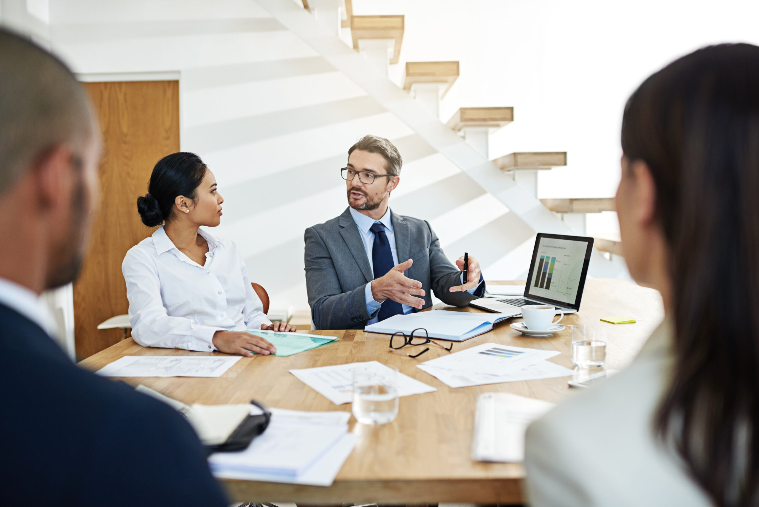 Account Executive presenting software solutions to a client, demonstrating how the product can solve their business needs and contribute to revenue growth.