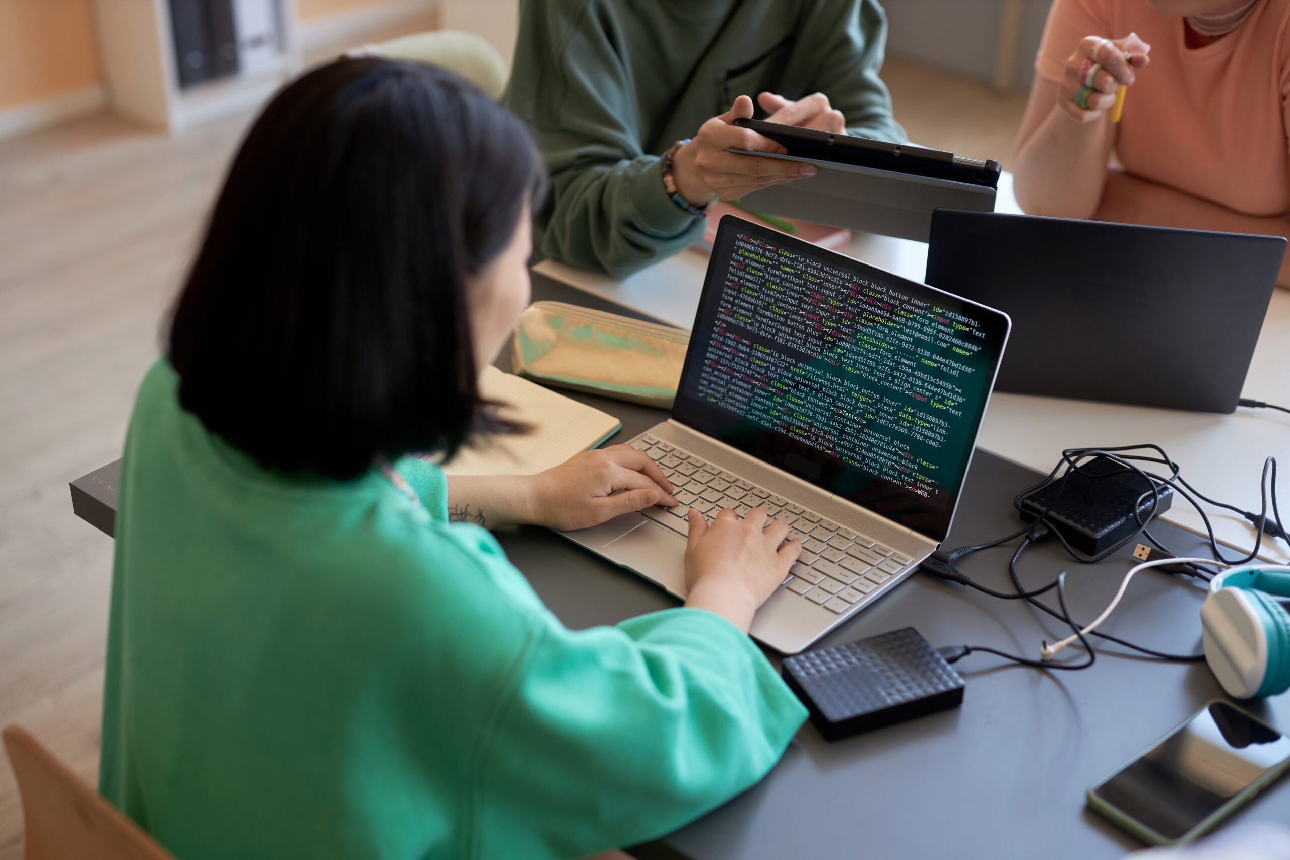 Individual coding on a computer, symbolizing the role of an education software engineer in the Edtech sector.