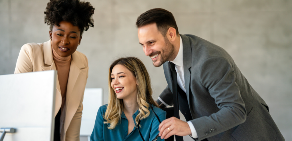 SaaS Sales Business professionals. Group of multiethnic business people analyzing data using computer while working as a team in the office