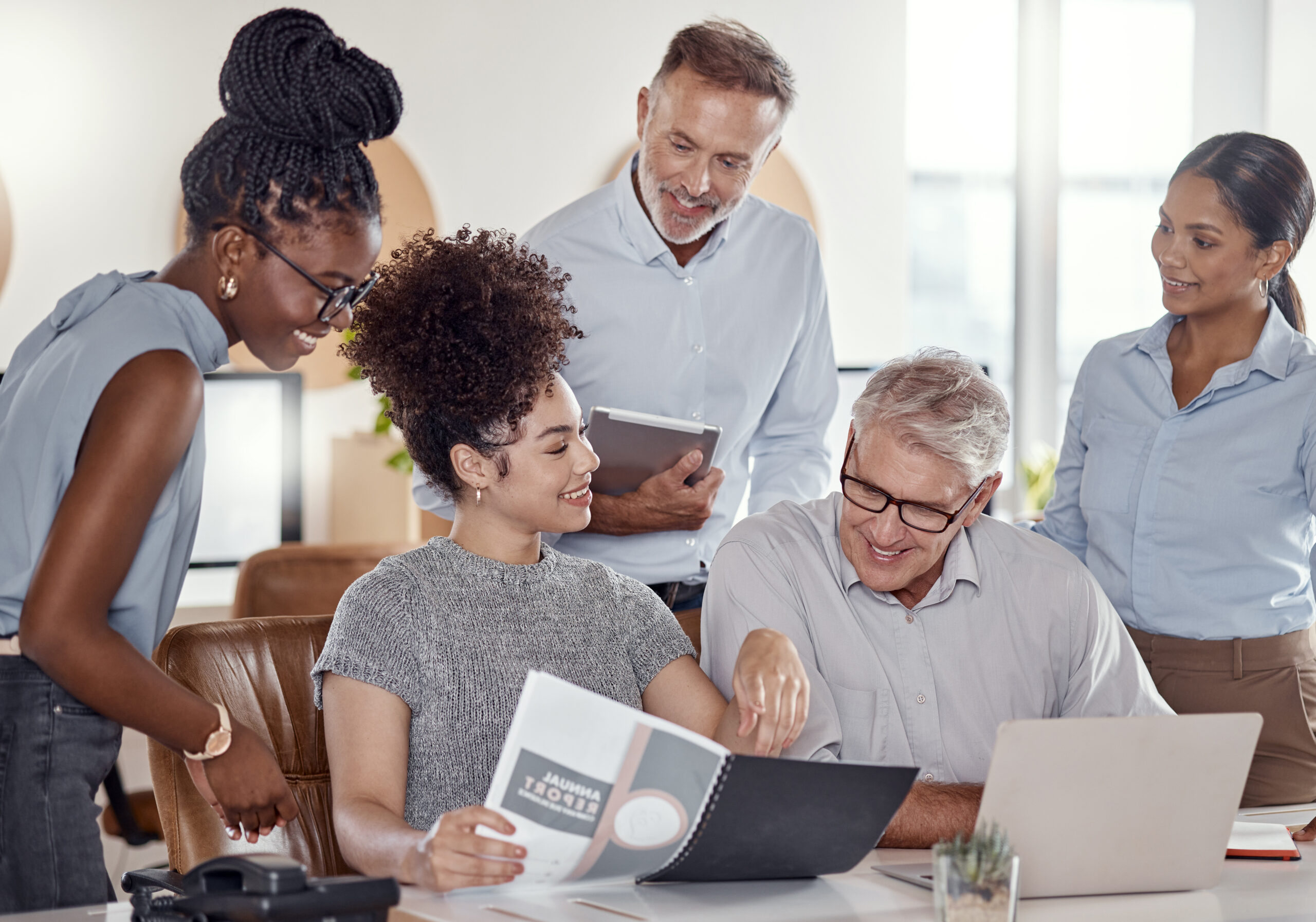 Shot of a group of SaaS Sales businesspeople having a meeting in a modern office.